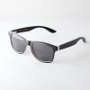 Bambook sunglasses with matte black and white frames; the lenses are dark grey. Designed in Canada