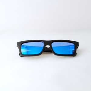 bamboo sunglasses folded on white background, with black arms and matte black frames. blue reflective lenses. Designed in Canada