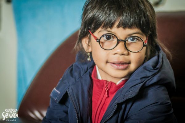 malagasy girls smiling wearing eyeglasses